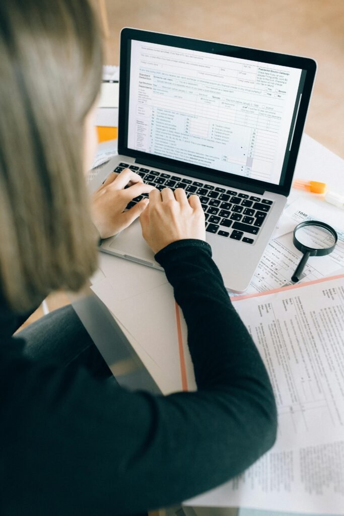 A close-up of a hand writing a personal statement, symbolizing the creative process of scholarship applications.
